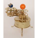 A replica brass three planet Orrery clock with chain driven mechanism,