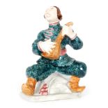 A 1930s Goldscheider (Staffordshire) Art Deco figure of a Cossack dancer playing a balalaika,