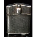 A George V hallmarked silver engine turned petrol lighter "The Beney Lighter" with hinged and