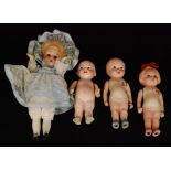 Two British made bisque dolls Lulu and Wuwu by Hamley Bros with painted features and costumes,