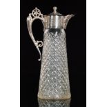 A George V hallmarked silver mounted cut glass claret jug of tapering form, height 28cm,