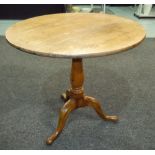 A 19th Century mahogany snap top supper table, later adapted with drop leaves,