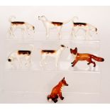 Five Beswick Foxhounds together with two Beswick Fox,