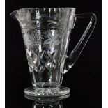 A 20th Century crystal glass jug of footed flared form and applied angular handle by Jack Lloyd for