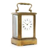 An early 20th Century French miniature brass and bevelled glass carriage clock by Margaine,