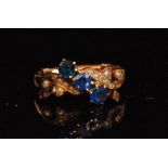 A 9ct three stone sapphire and seed pearl ring,