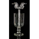 A late 19th to early 20th Century clear crystal glass marriage goblet of footed form with a central