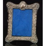 A Victorian hallmarked silver mounted photograph frame of rectangular outline with C scroll and