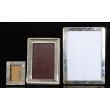 Three hallmarked silver rectangular photograph frames,