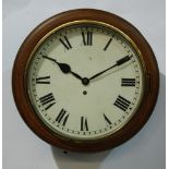 An early 20th Century single fusee circular mahogany cased schoolroom clock with painted white dial,