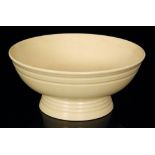 A Keith Murray for Wedgwood Art Deco footed bowl decorated in Matt Straw,