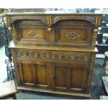 A 17th Century style carved oak court cupboard,