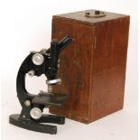 A 20th Century microscope by Cooke Troughton & Simms No 107455 in oak case