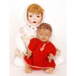 A Simon and Halbig bisque head doll marked PB within a star ,fixed brown eyes and open mouth,