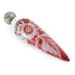 A Thomas Webb & Sons torpedo form cameo glass scent bottle cased in opal over ruby with a floral