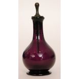 A late Georgian amethyst glass scent bottle circa 1780 of footed spherical form with a slender