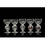 A set of five 1930s Stevens & Williams clear crystal glass goblets with a cup form bowl above a