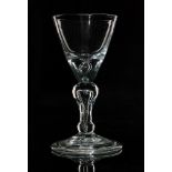 An 18th Century dark metal light baluster drinking glass circa 1700,