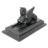 A John Derbyshire pressed glass figure of a Theban Sphinx Circa 1876 in matte black the rectangular