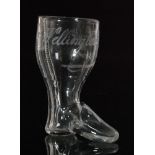 A 19th Century novelty shot glass in the form of a Wellington boot with applied clear crystal