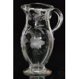 A late 18th Century wine jug circa 1780 of footed baluster form with flared rim,