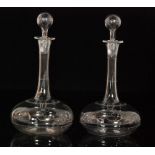 A pair of late 19th Century crystal glass decanters of globe and shaft form with an engraved cypher