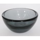 A post war Orrefors Kraka glass bowl designed by Sven Palmqvist of circular section with heavy