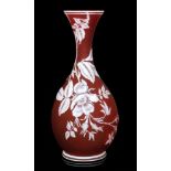 A late 19th Century Thomas Webb & Sons cameo glass vase of footed ovoid form with a waisted and