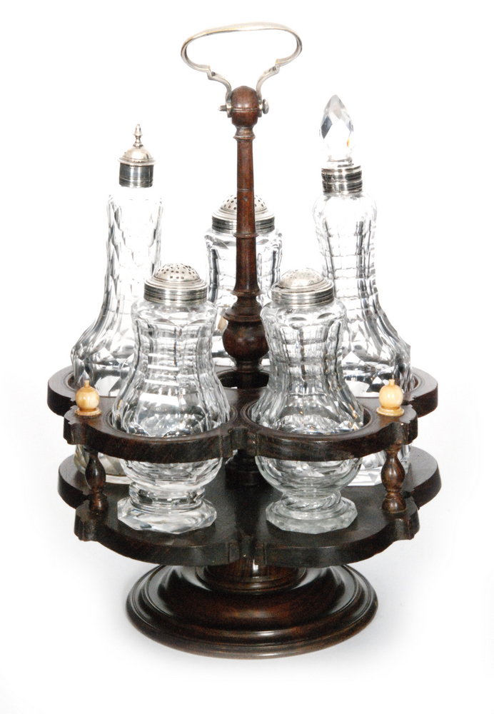 A late 18th Century cruet set comprising five matched clear crystal glass bottles all with flat cut