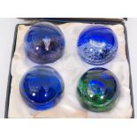 A set of four later 20th Century Caithness limited edition paperweights designed by Colin Terris