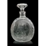 An early 20th Century Stevens & Williams clear crystal glass decanter of spherical form with a