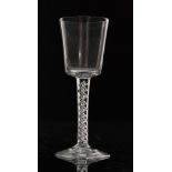 An 18th Century drinking glass circa 1760, large bucket form bowl above a mercury twist stem,