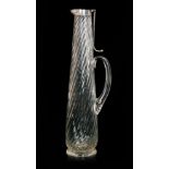 A late 19th Century Stevens & Williams clear crystal glass claret jug of footed and tapered