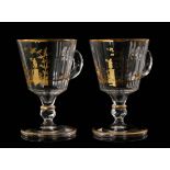 A pair of early 20th Century Baccarat crystal glass punch cups with spread foot to a lapidary knop