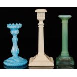 Three assorted 19th Century pressed glass candlesticks comprising one blue marbled,
