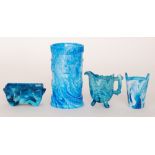 Four pieces of 19th Century blue marbled pressed glass comprising a cylindrical vase with moulded