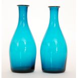 A pair of early 19th Century bottle form carafes each engraved with VICTORY - 1815 over the deep