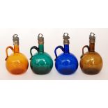 A set of four 19th Century finger loop decanters of compressed ovoid form with applied loop handle,