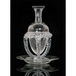 A late 19th Century Stourbridge clear crystal glass carafe of pointed ovoid form with a flared