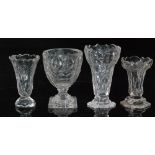 A late 18th Century clear crystal glass syllabub glass of elongated ogee form with a scalloped rim