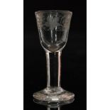 A miniature clear crystal drinking glass in the 18th Century taste with a round funnel bowl cut and