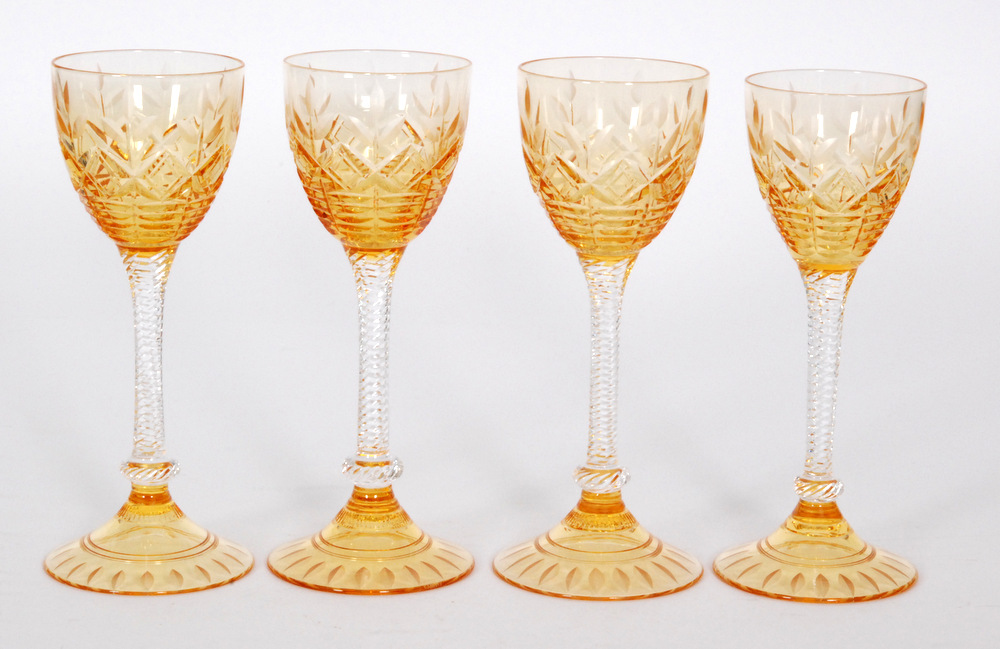 A set of four 1930s Stuart & Sons Art Deco wine glasses with a golden amber bowl cut and polished