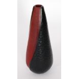 A 20th Century Italian glass vase tapered form cased in black over a deep ruby decorated with