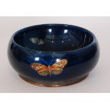 A 1920s fruit bowl by Albert Henry Guest, DG Ware, of footed double walled form,