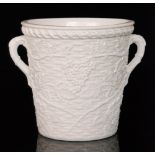 A 19th Century white pressed glass wine bucket decorated with moulded grape vines and foliage over