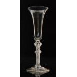 An 18th Century ale glass circa 1755 with a slender drawn bell bowl above a multiple series air