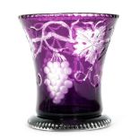 A 1930s Stevens & Williams footed flared vase in amethyst over clear crystal intaglio cut with