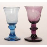 A 19th Century miniature amethyst glass goblet in the 18th Century style with a round funnel bowl
