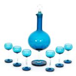 A post war Riihimaki Harlekini glass liqueur set designed by Nanny Still the the sapphire blue