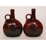 A pair of 19th Century finger loop decanters of compressed ovoid form with slender collar neck and